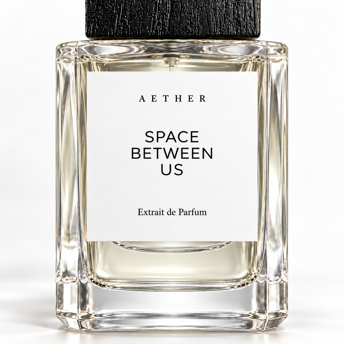 Space Between Us Extrait de Parfum — close detail of the white label, glass and textured black cap